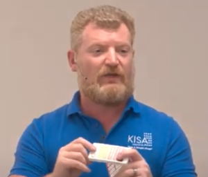 Screenshot of Dmitry pointing to rubber bumps on lower part of phone screen